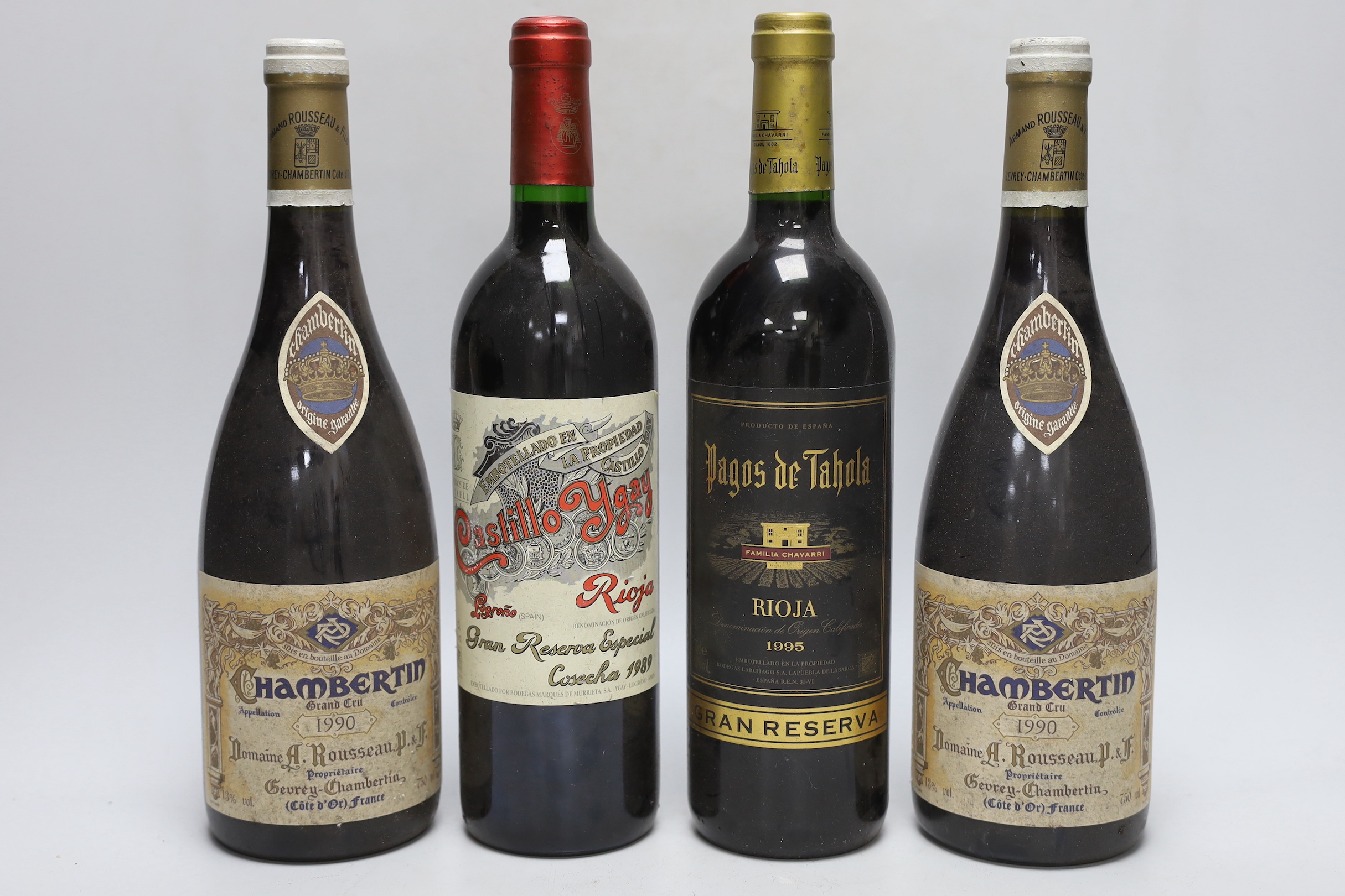 Four bottles of wine: two bottle of 75cl 1990 Chambertin Grand Cru, Armand Rousseau, one bottle of 75cl 1995 Pagos de Tahola Rioja, and one bottle of 75cl 1989 Casillo Ygay